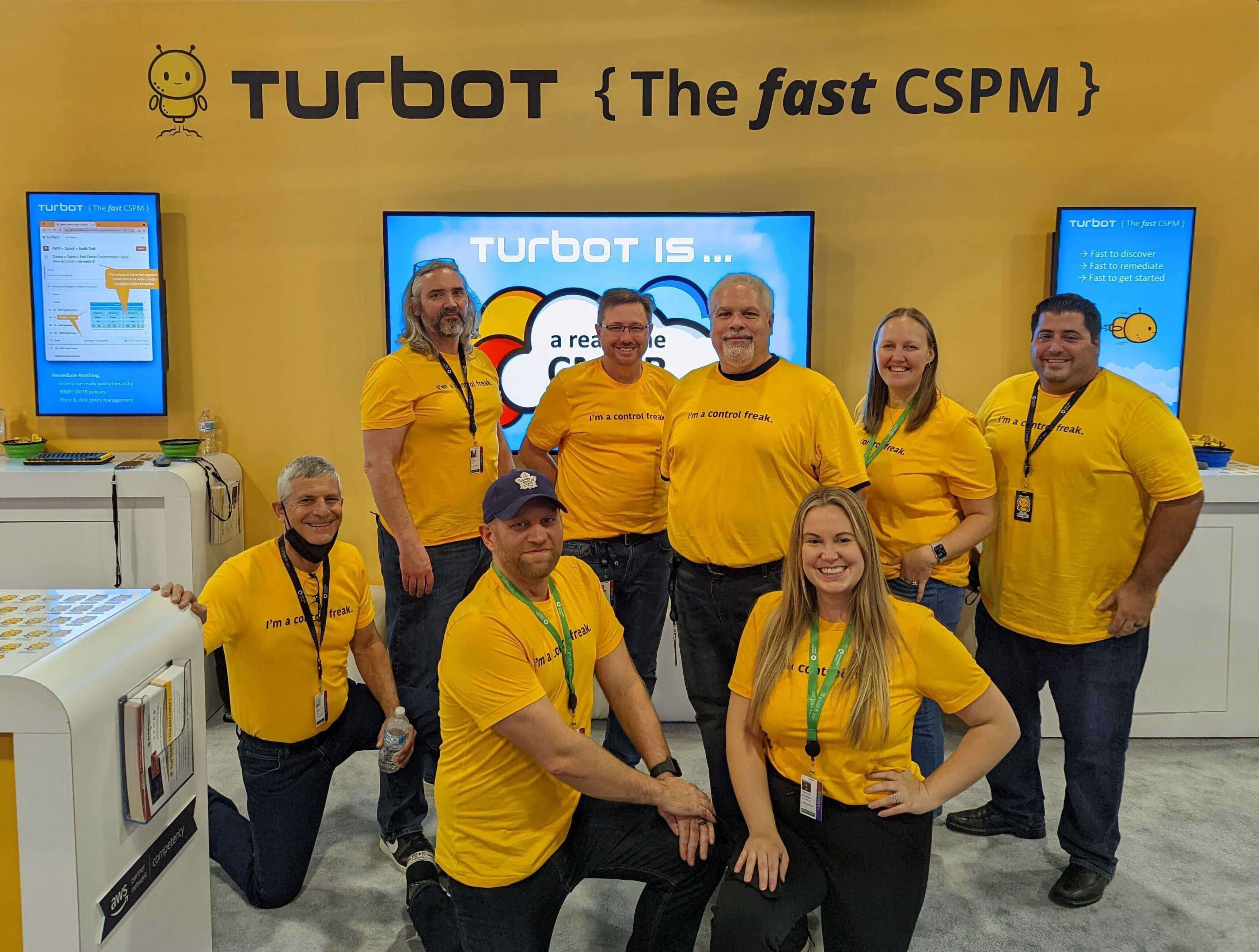 Turbot team in front of our 2021 re:Invent booth